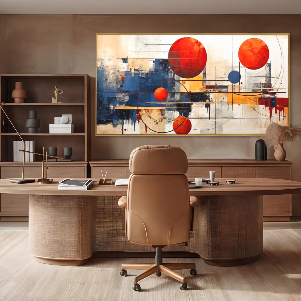 Tablou canvas cu pictura abstracta cu sfere rosii si orbite, in rama de aluminiu auriu, pe perete intr-un birou